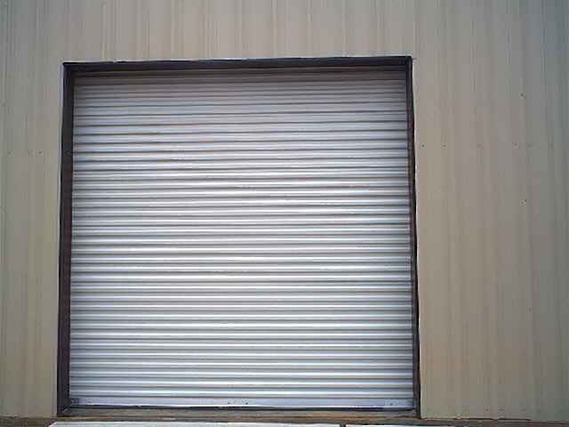 View of the outside of the sheet type rollup door installed in the North wall